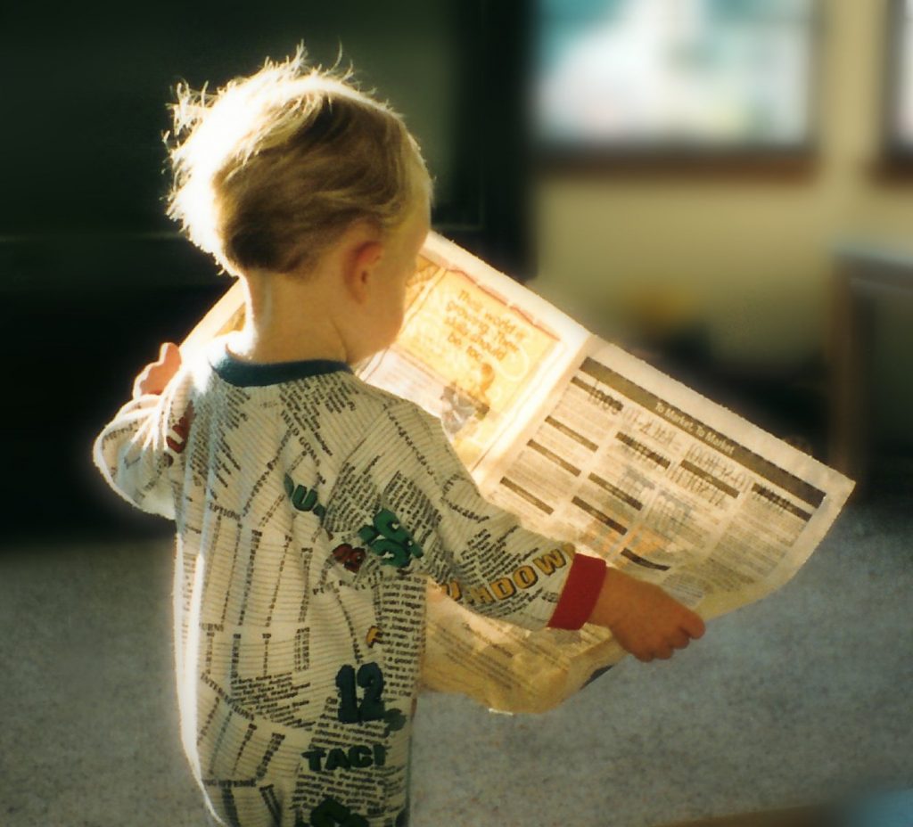 read newspaper child
